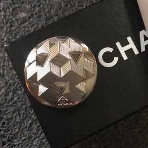 Silver pin made from a large button